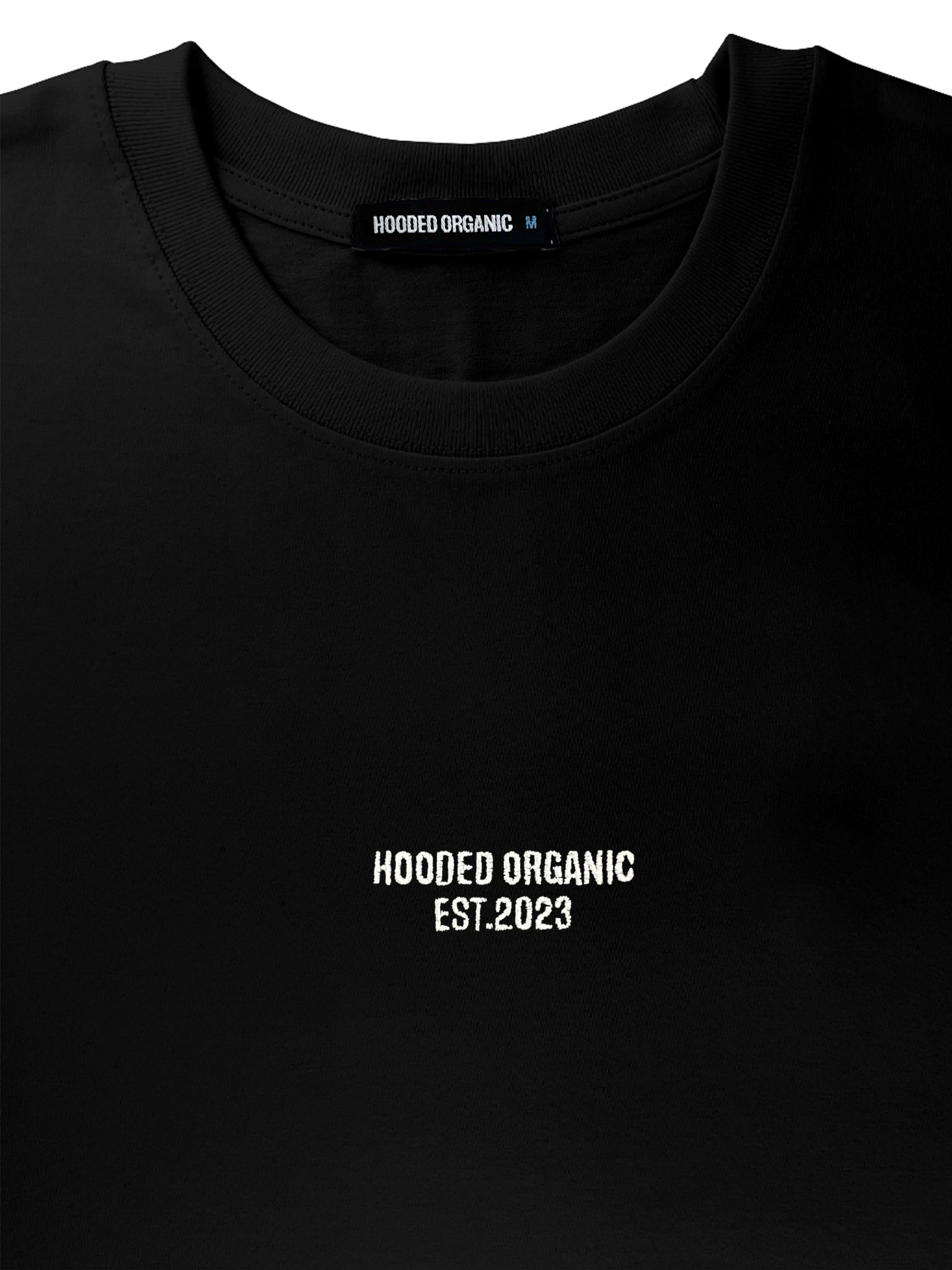 Close-up af stoffet på sort blank T-shirt – 100% økologisk og blød tekstur
